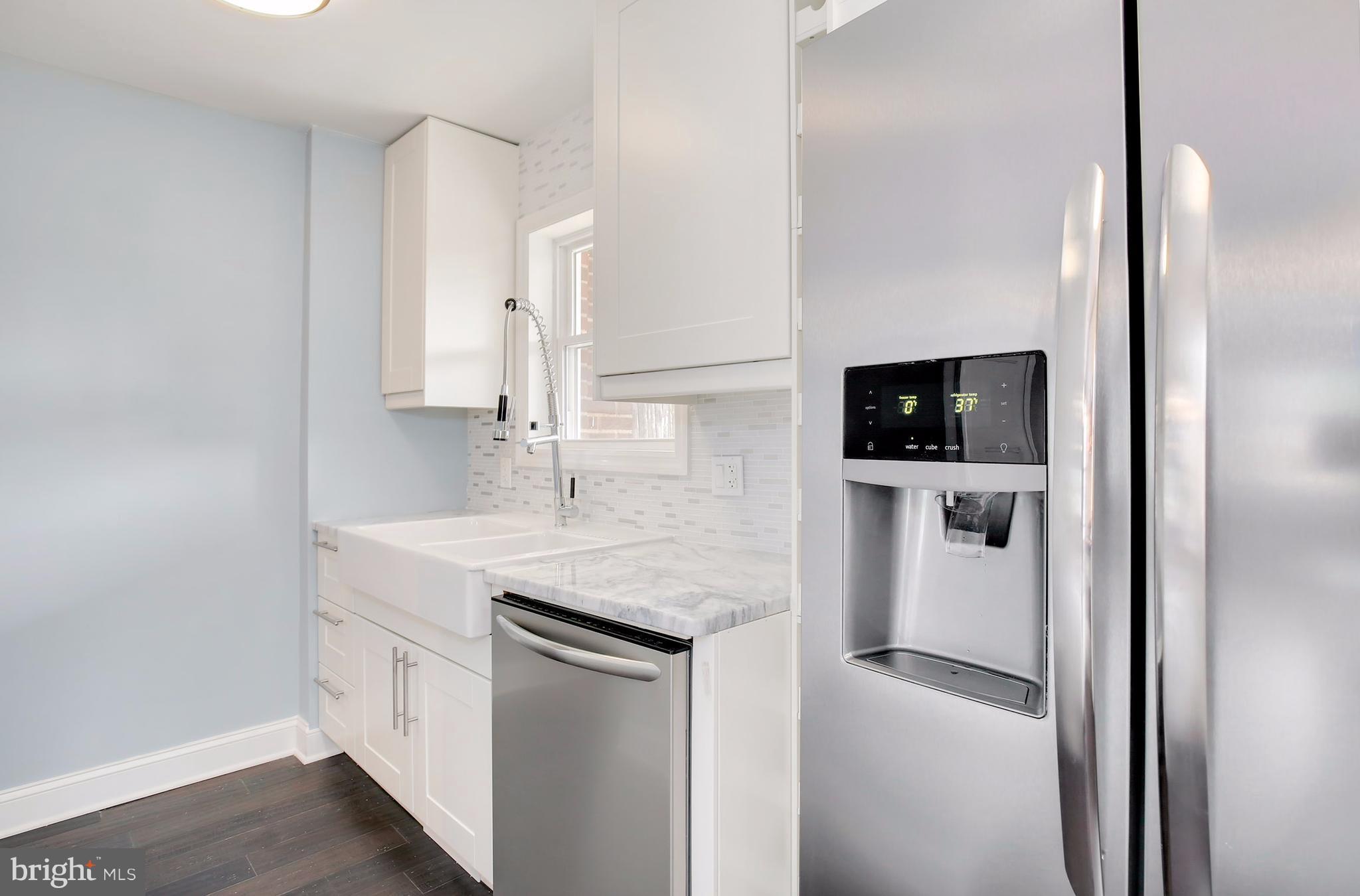 4928 Sargent Road Northeast Washington, DC 20017 - Photo 14 of 30 a bathroom with a sink a toilet and mirror
