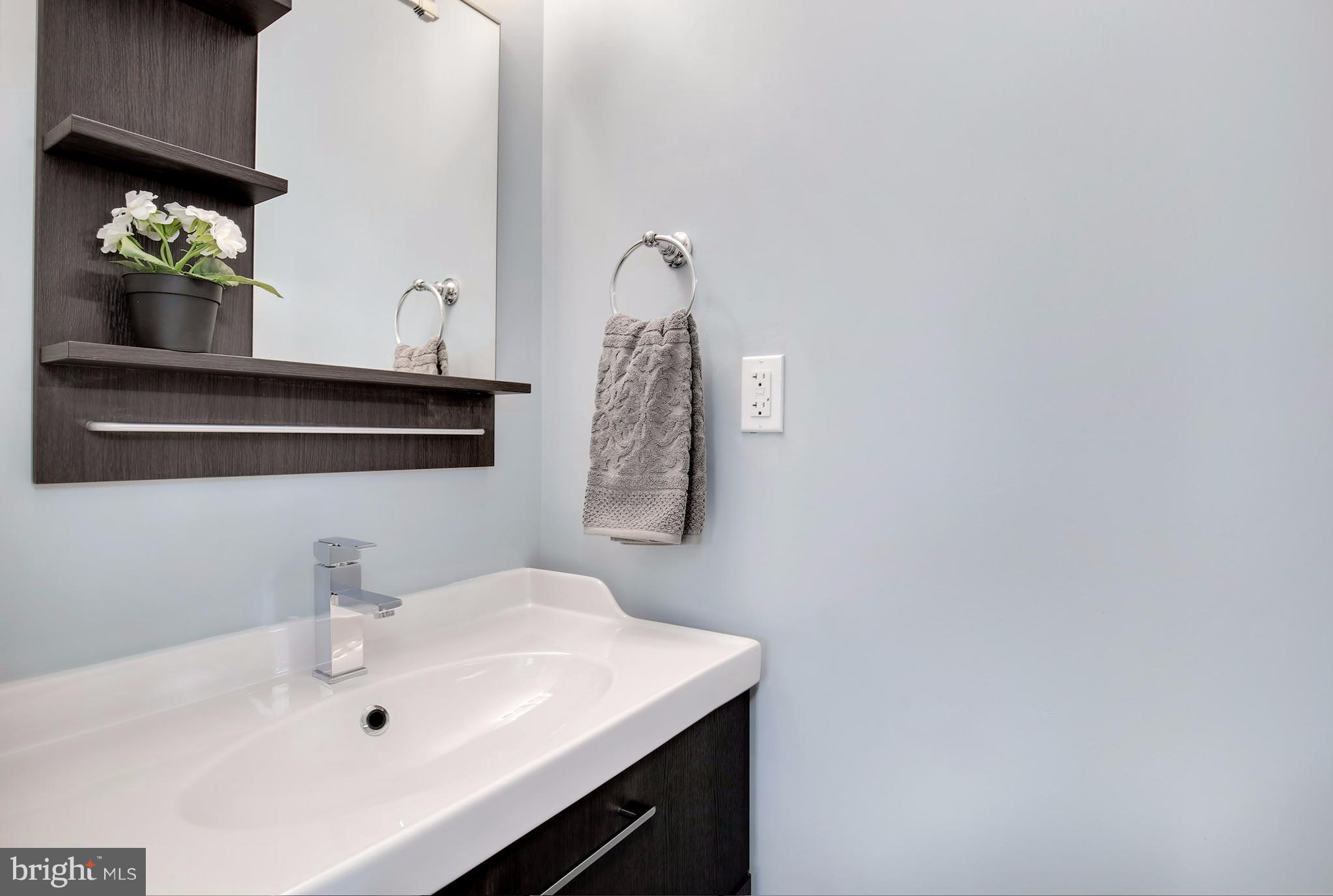 4928 Sargent Road Northeast Washington, DC 20017 - Photo 10 of 30 a bathroom with a sink and a mirror
