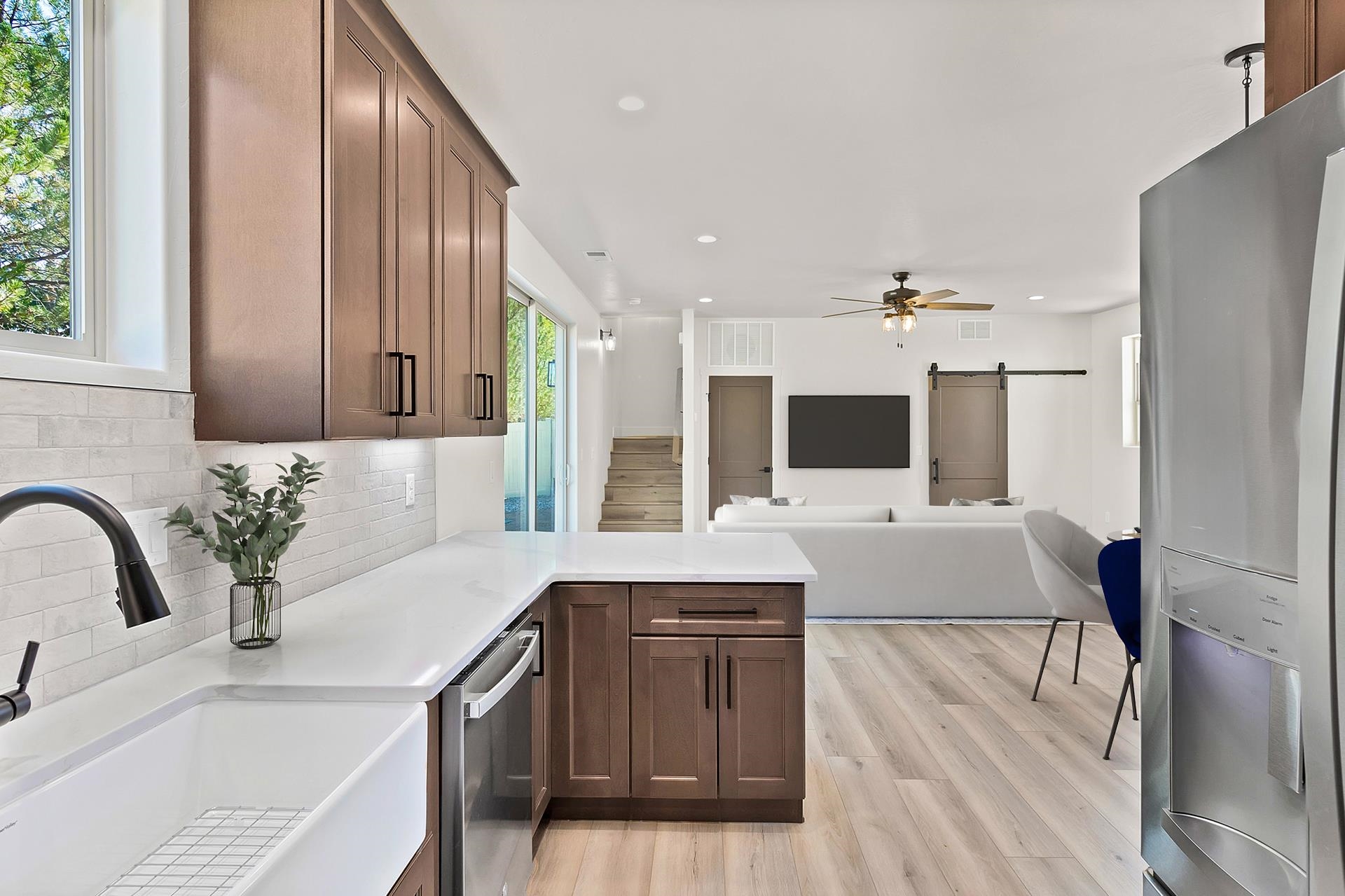 1111 Sprocket Court Fruita, CO 81521 - Photo 14 of 41 a large kitchen with kitchen island a sink stainless steel appliances and cabinets