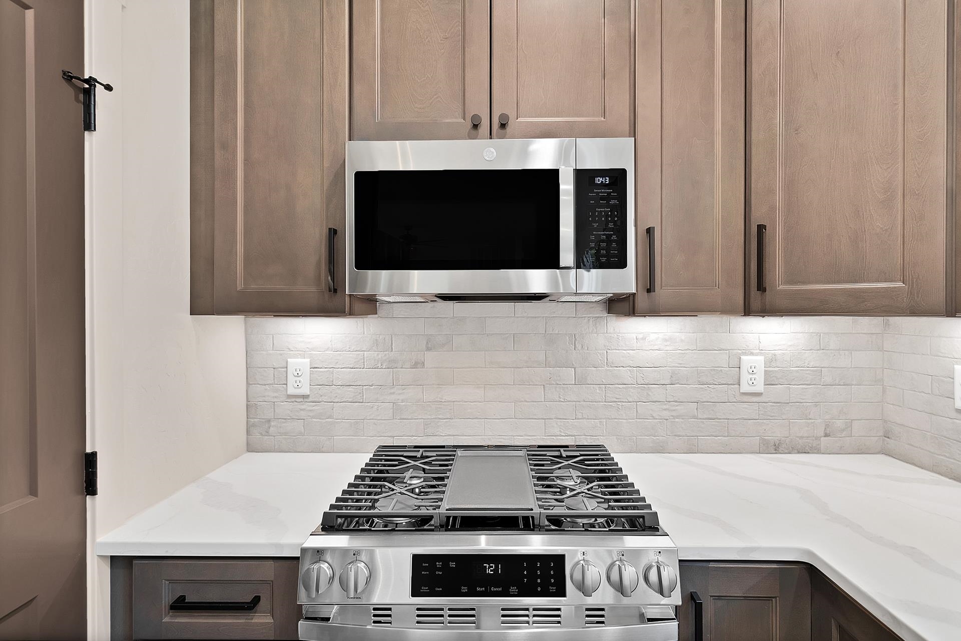 1111 Sprocket Court Fruita, CO 81521 - Photo 15 of 41 a kitchen with a stove and a microwave