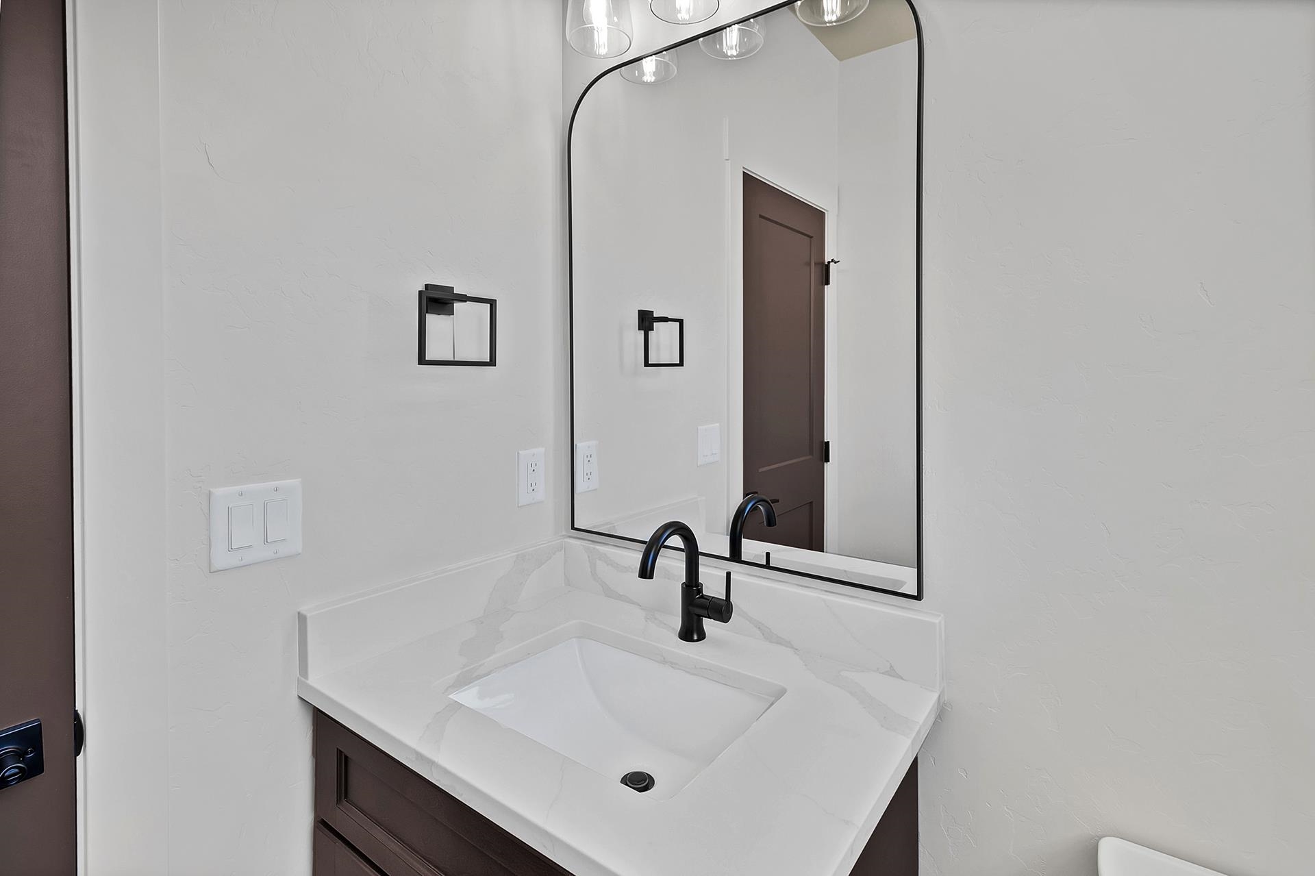 1111 Sprocket Court Fruita, CO 81521 - Photo 20 of 41 a bathroom with a sink and a mirror