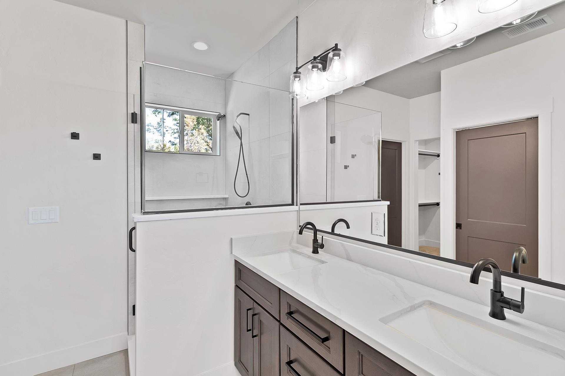 1111 Sprocket Court Fruita, CO 81521 - Photo 26 of 41 a bathroom with a sink and a mirror
