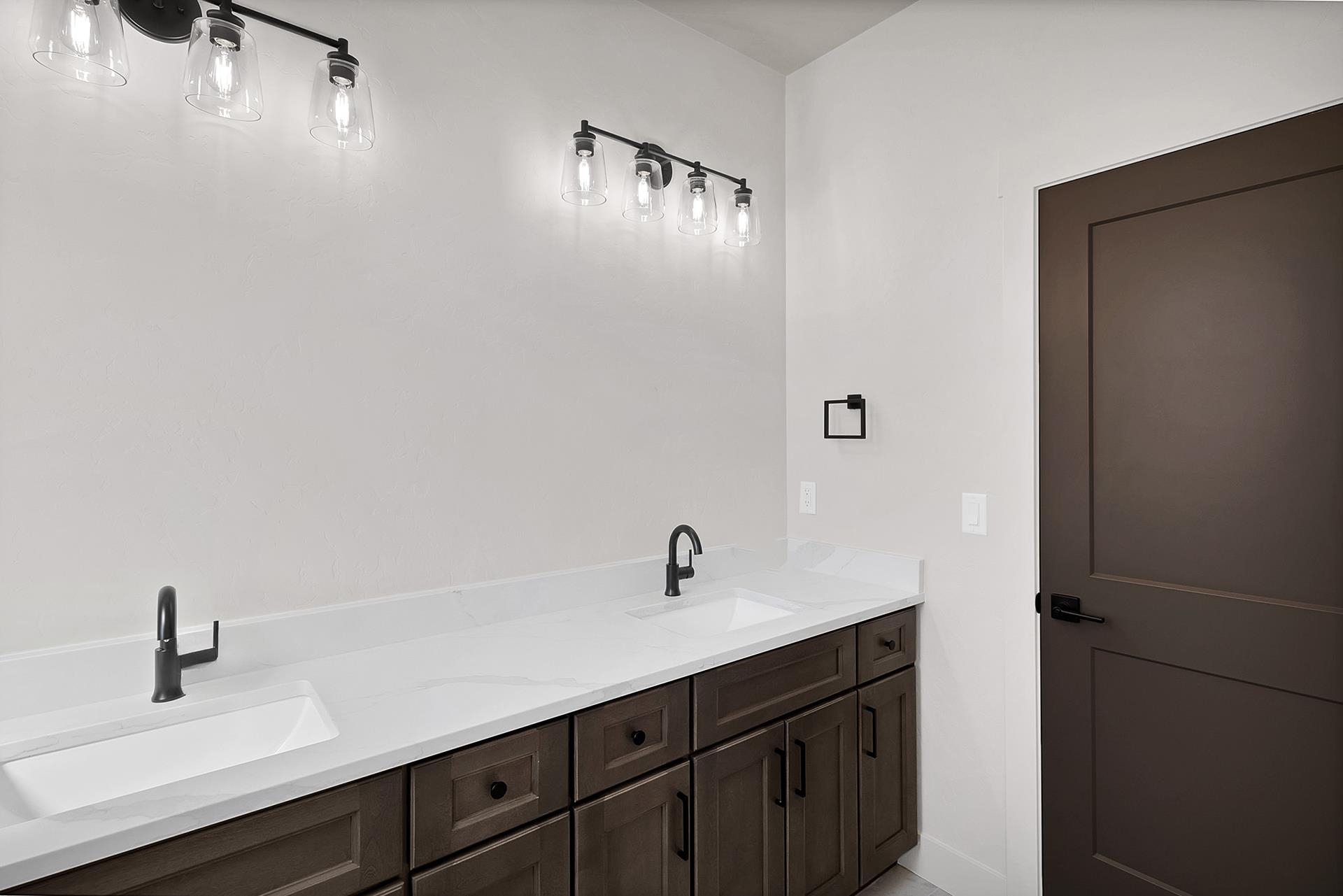 1111 Sprocket Court Fruita, CO 81521 - Photo 31 of 41 a bathroom with a sink and mirror