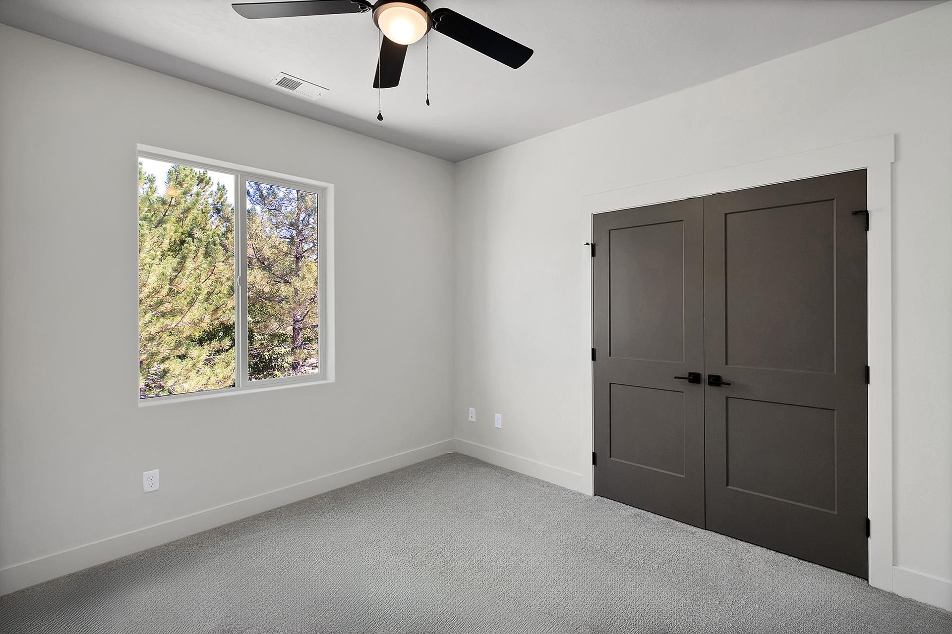 1111 Sprocket Court Fruita, CO 81521 - Photo 33 of 41 a view of an empty room with a window