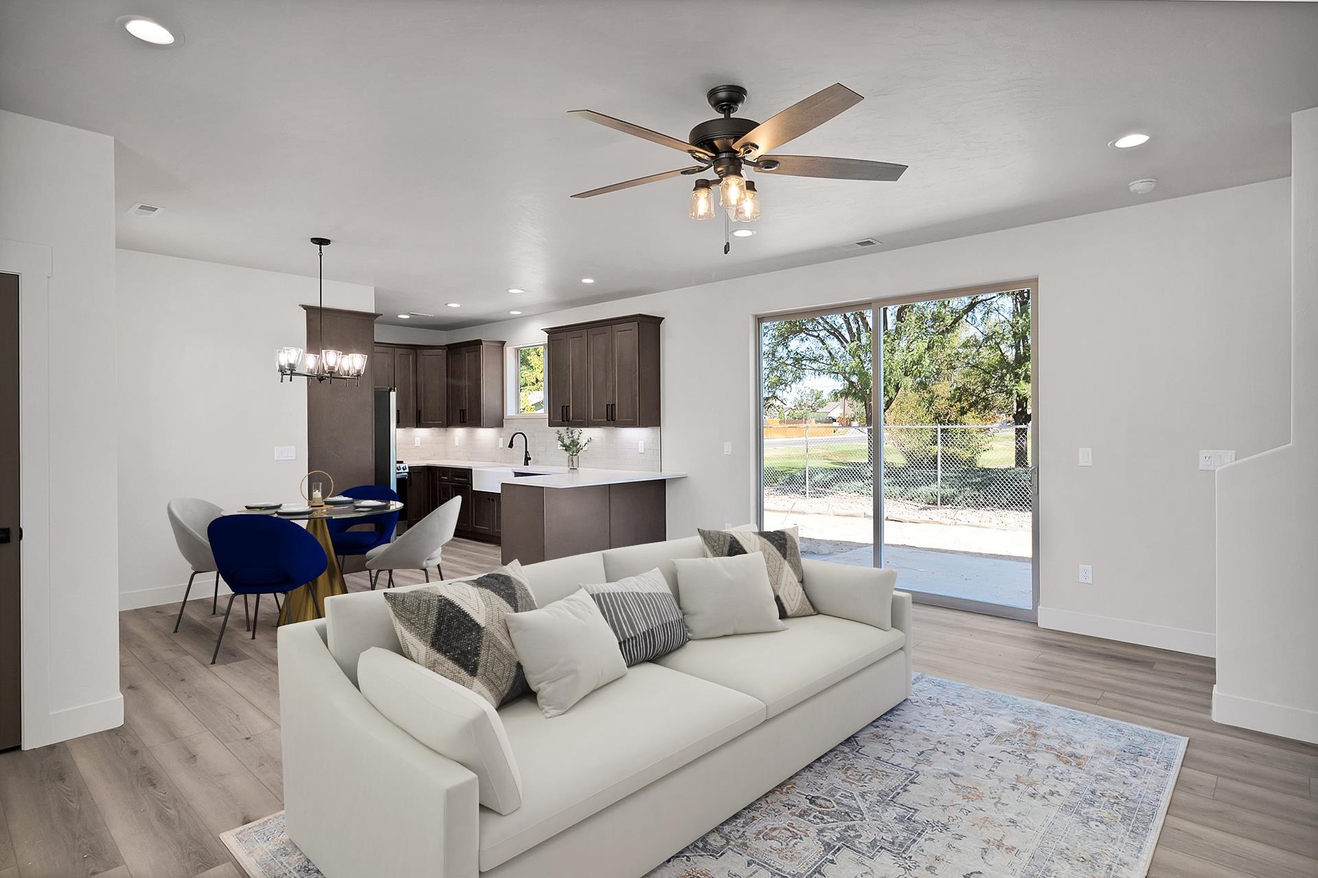 1111 Sprocket Court Fruita, CO 81521 - Photo 6 of 41 a living room with furniture and a large window