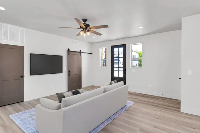 a large kitchen with kitchen island a sink stainless steel appliances and cabinets