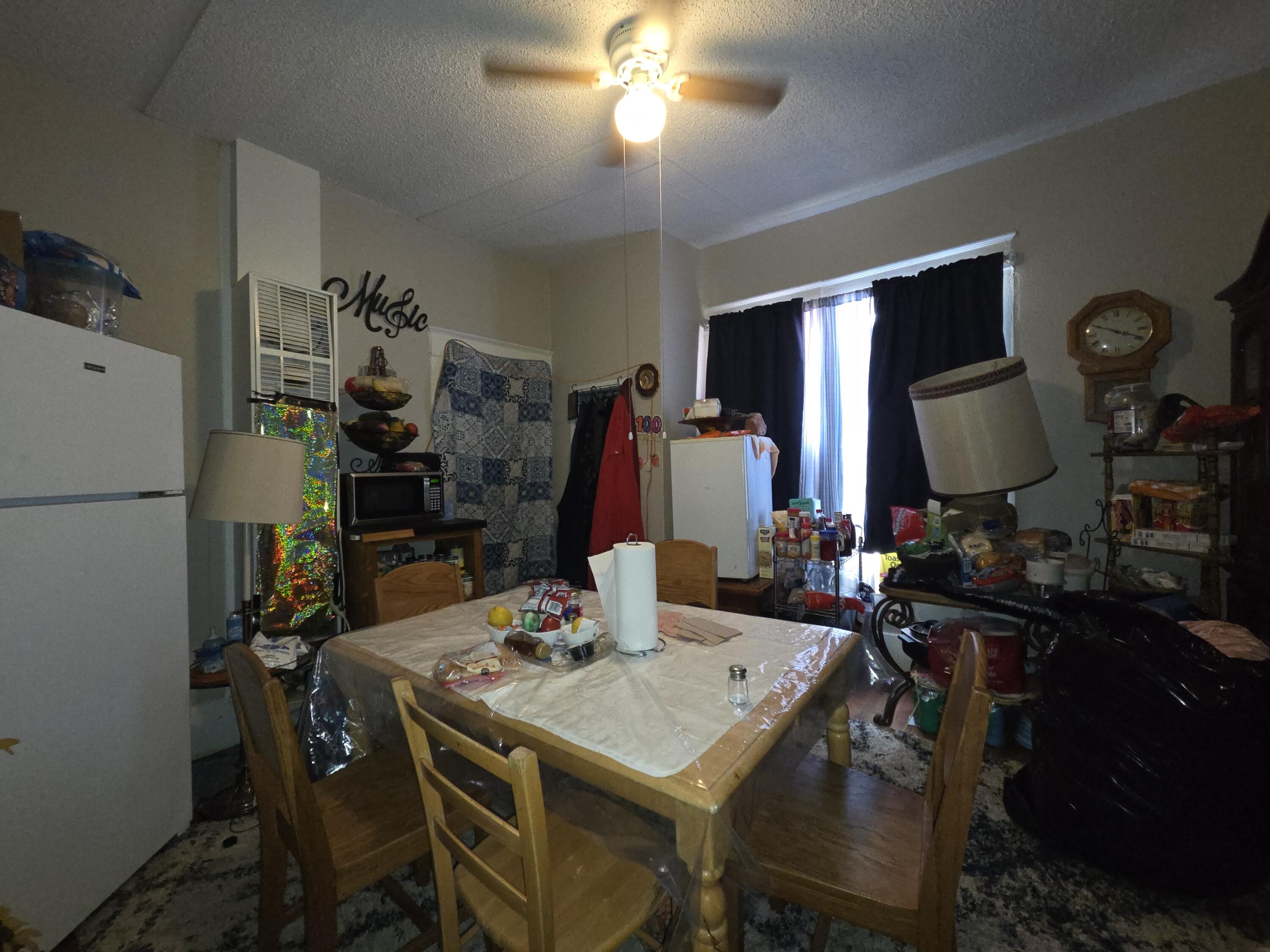 706 29th Street Lubbock, TX 79404 - Photo 7 of 8 a view of a dining room with furniture and chandelier