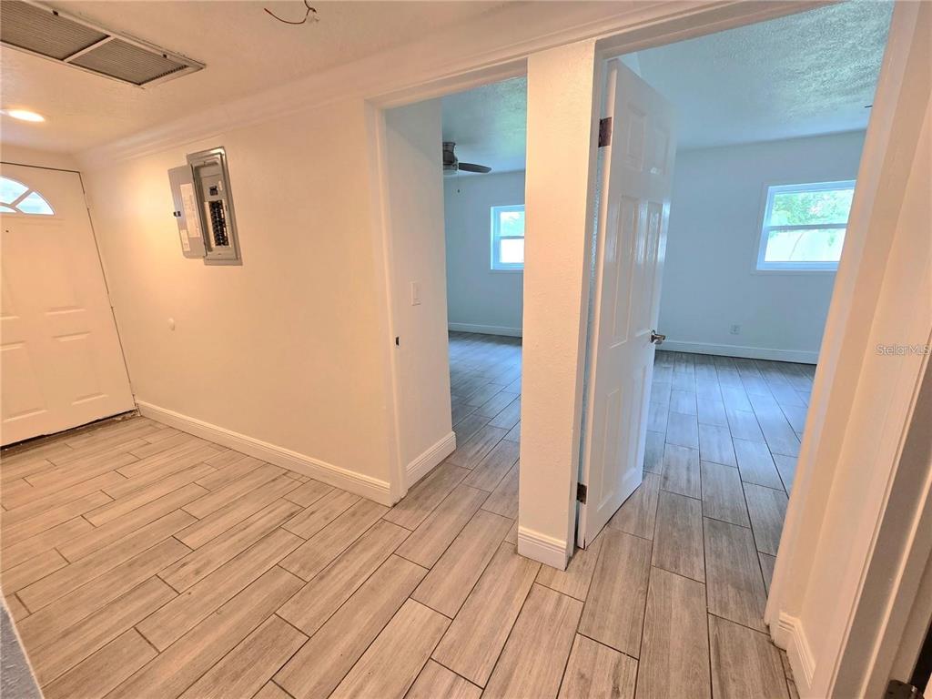 812 High Street Orlando, FL 32803 - Photo 8 of 15 an empty room with wooden floor and windows
