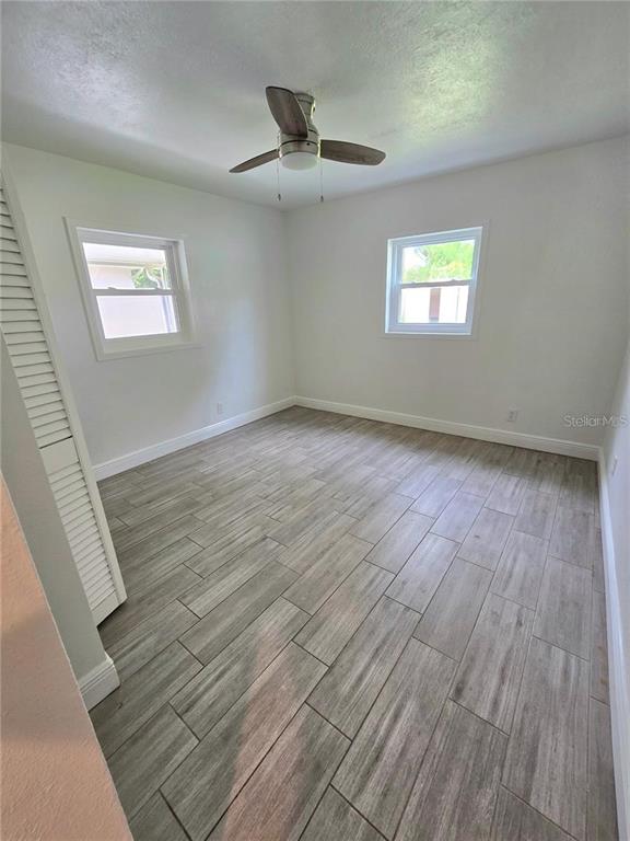 812 High Street Orlando, FL 32803 - Photo 9 of 15 a view of an empty room with wooden floor and a window