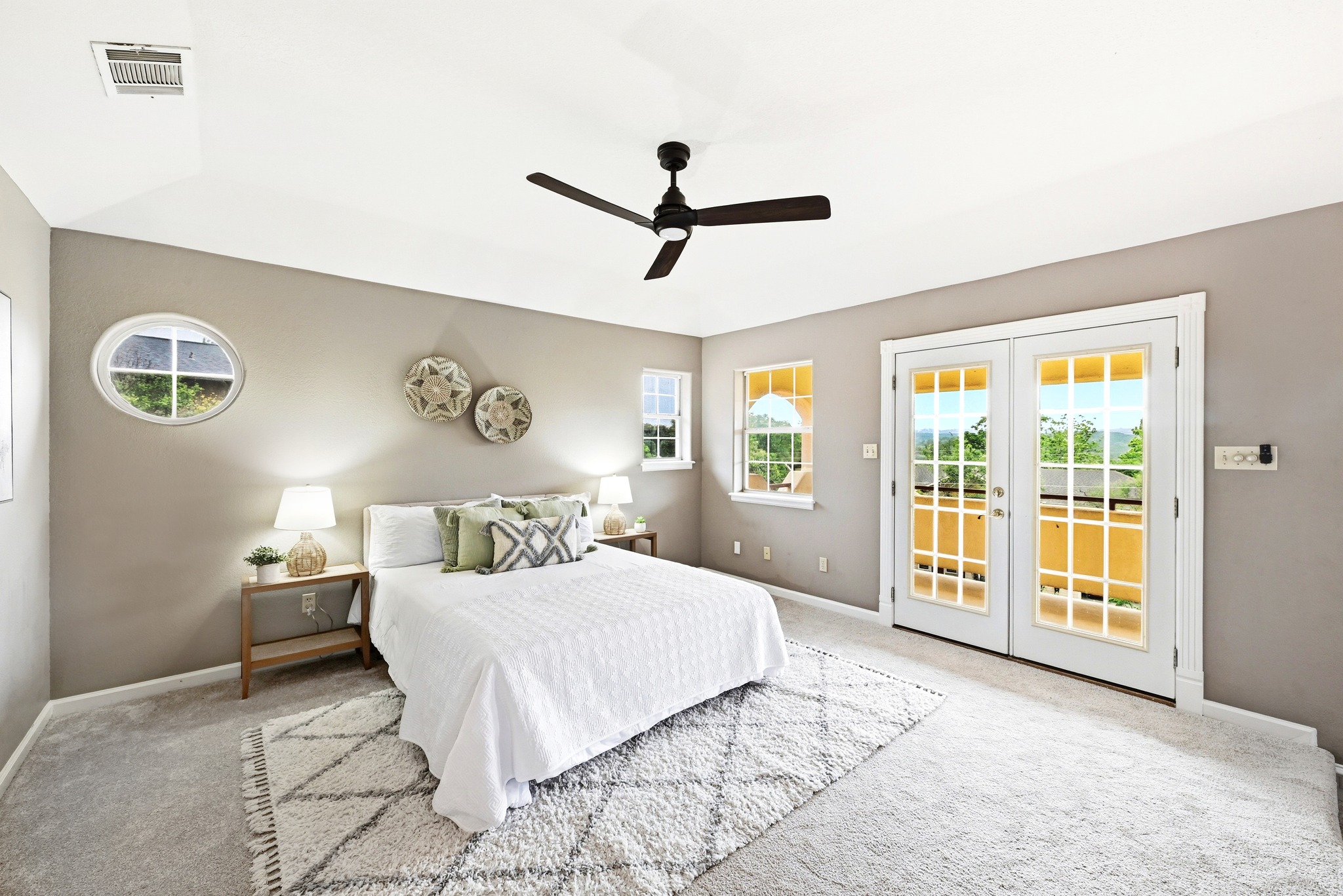 2405 Bahama Road Austin, TX 78733 - Photo 22 of 39 a bedroom with a large bed and a window