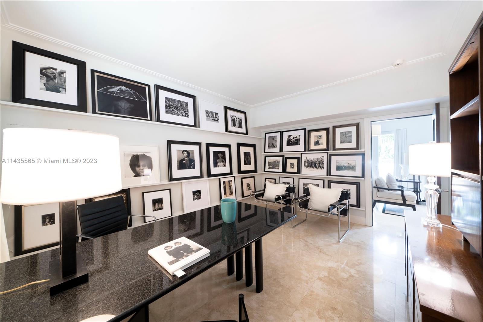 5959 La Gorce Drive Miami Beach, FL 33140 - Photo 18 of 60 a living room with furniture a rug and a flat screen tv