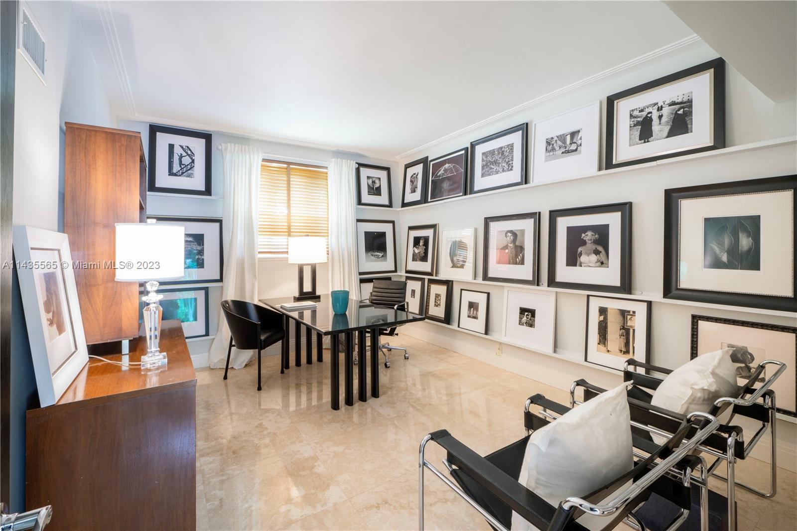 5959 La Gorce Drive Miami Beach, FL 33140 - Photo 19 of 60 a living room with furniture dining area and a table