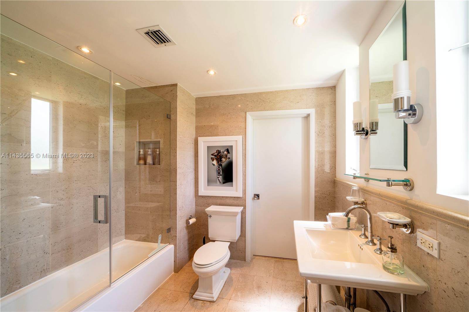 5959 La Gorce Drive Miami Beach, FL 33140 - Photo 20 of 60 a bathroom with a sink a toilet and shower