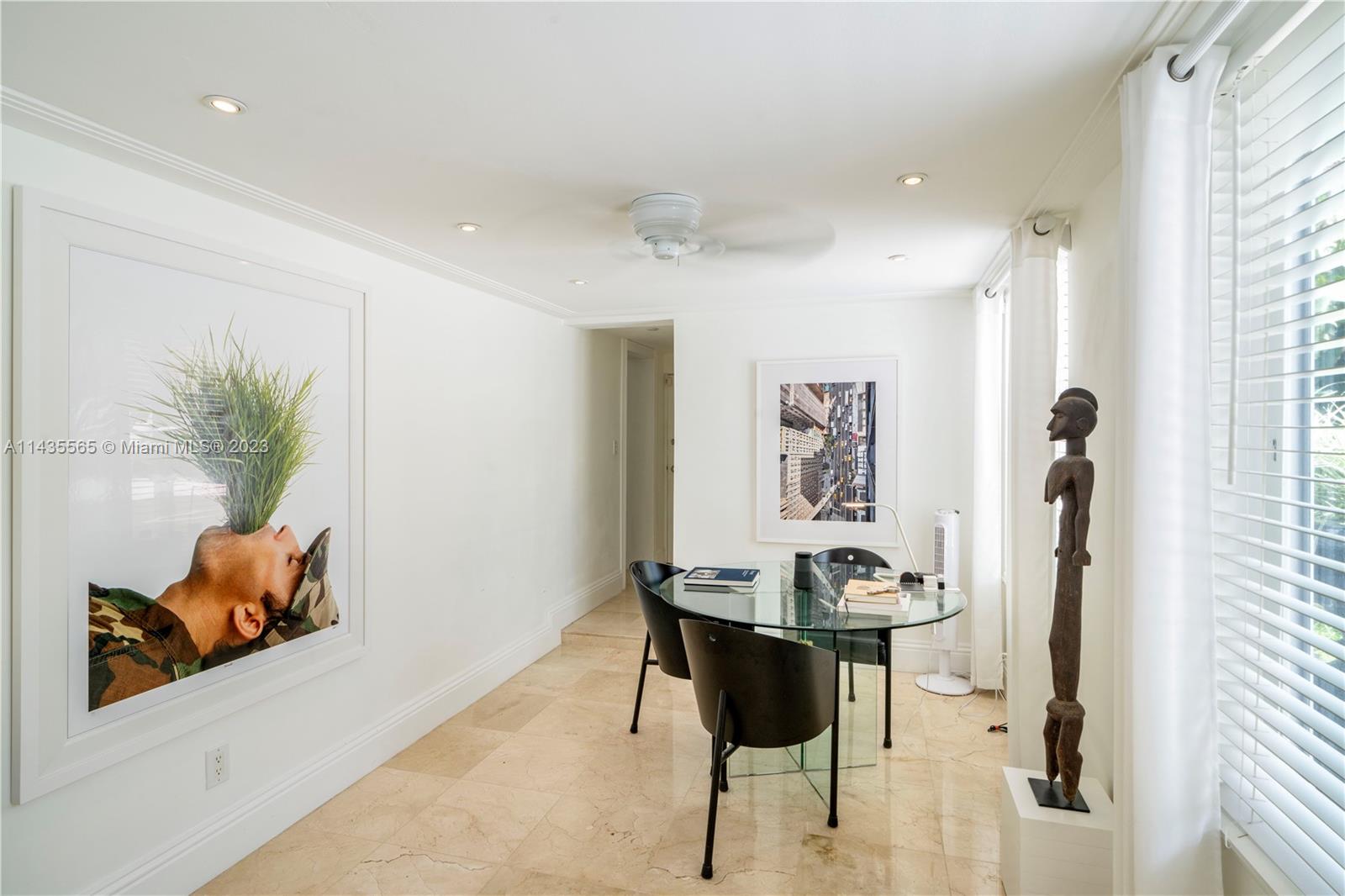 5959 La Gorce Drive Miami Beach, FL 33140 - Photo 21 of 60 a view of a dining room with furniture and front door