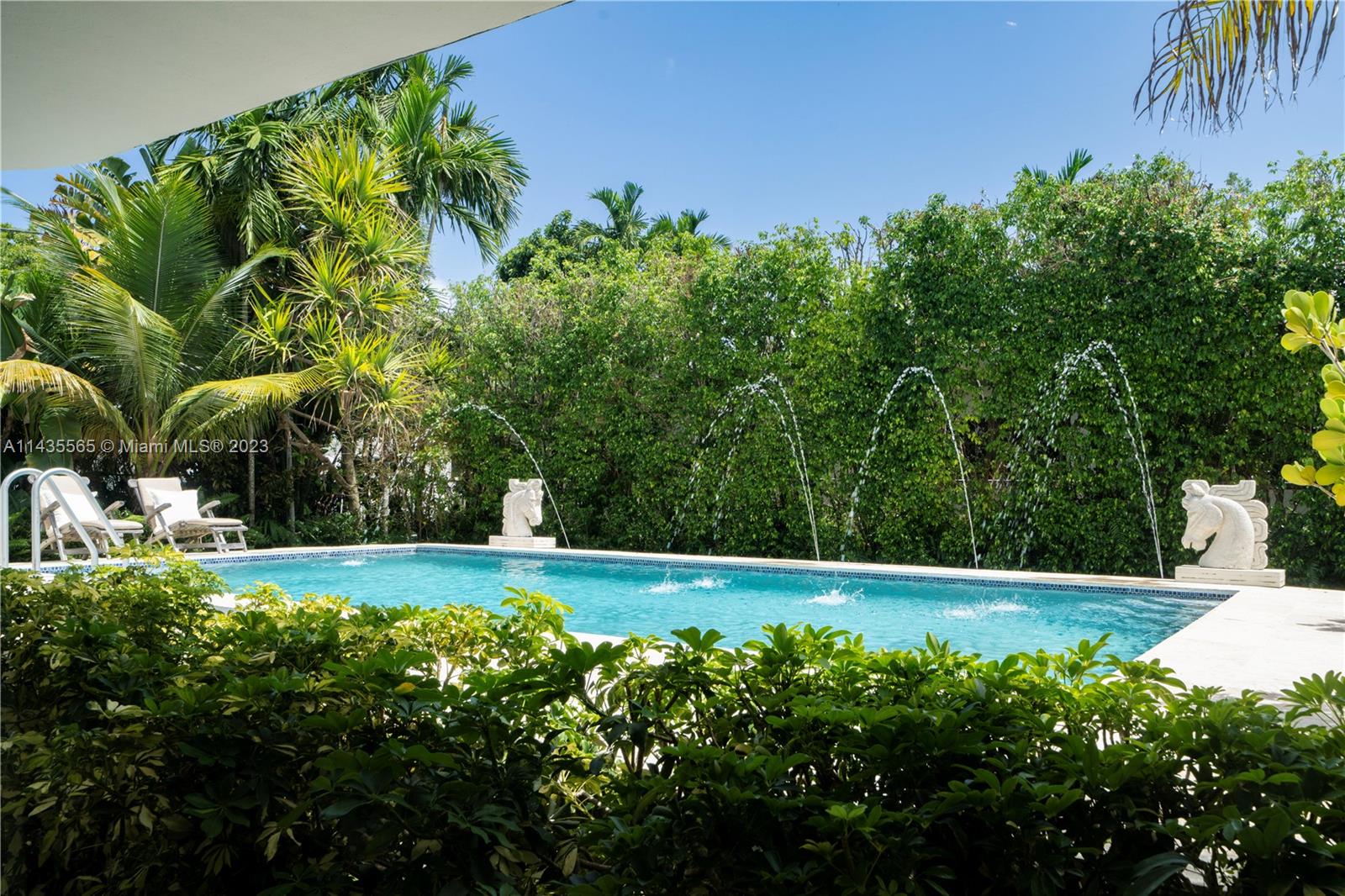 5959 La Gorce Drive Miami Beach, FL 33140 - Photo 24 of 60 a view of a yard with plants and large trees