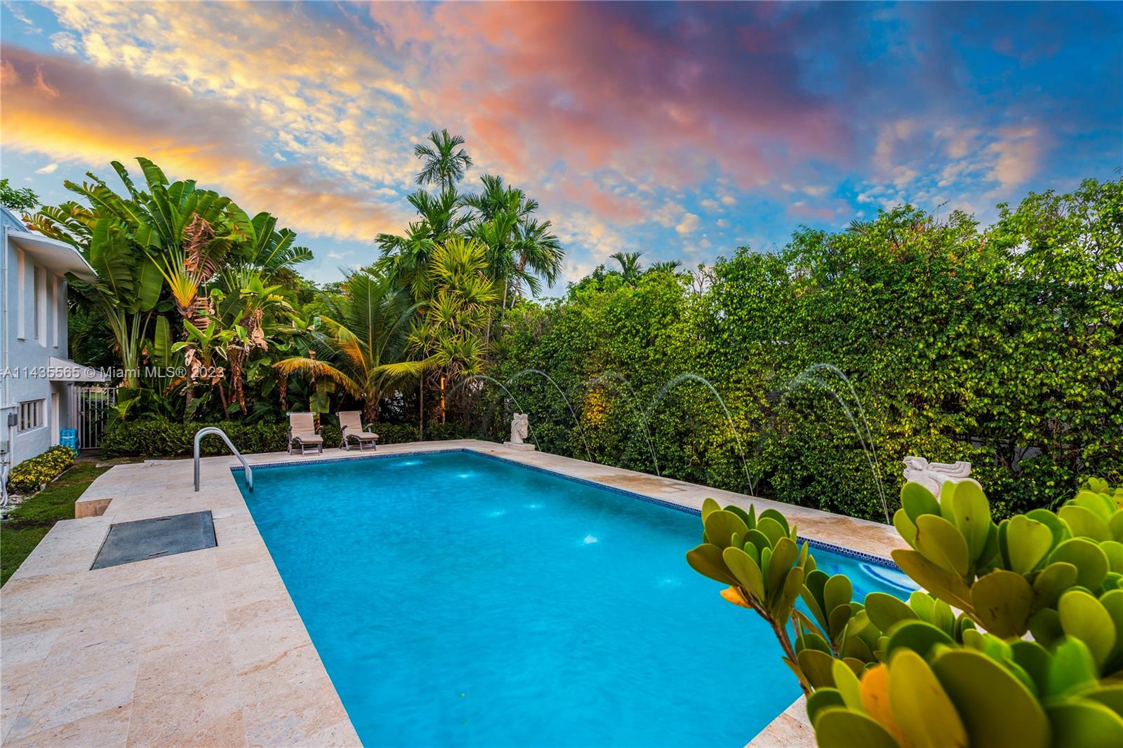 5959 La Gorce Drive Miami Beach, FL 33140 - Photo 26 of 60 a view of a swimming pool with an outdoor seating