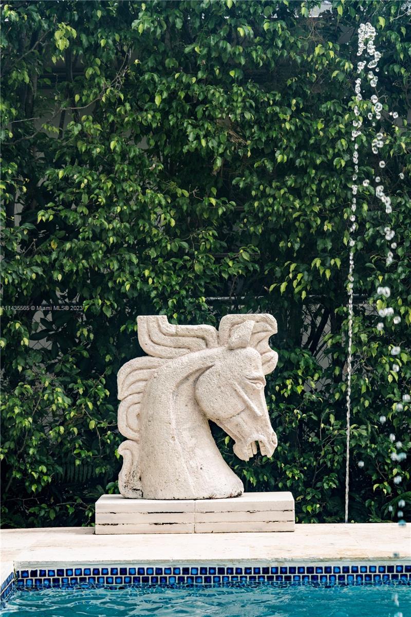 5959 La Gorce Drive Miami Beach, FL 33140 - Photo 29 of 60 a view of a white house with a sink and sitting area