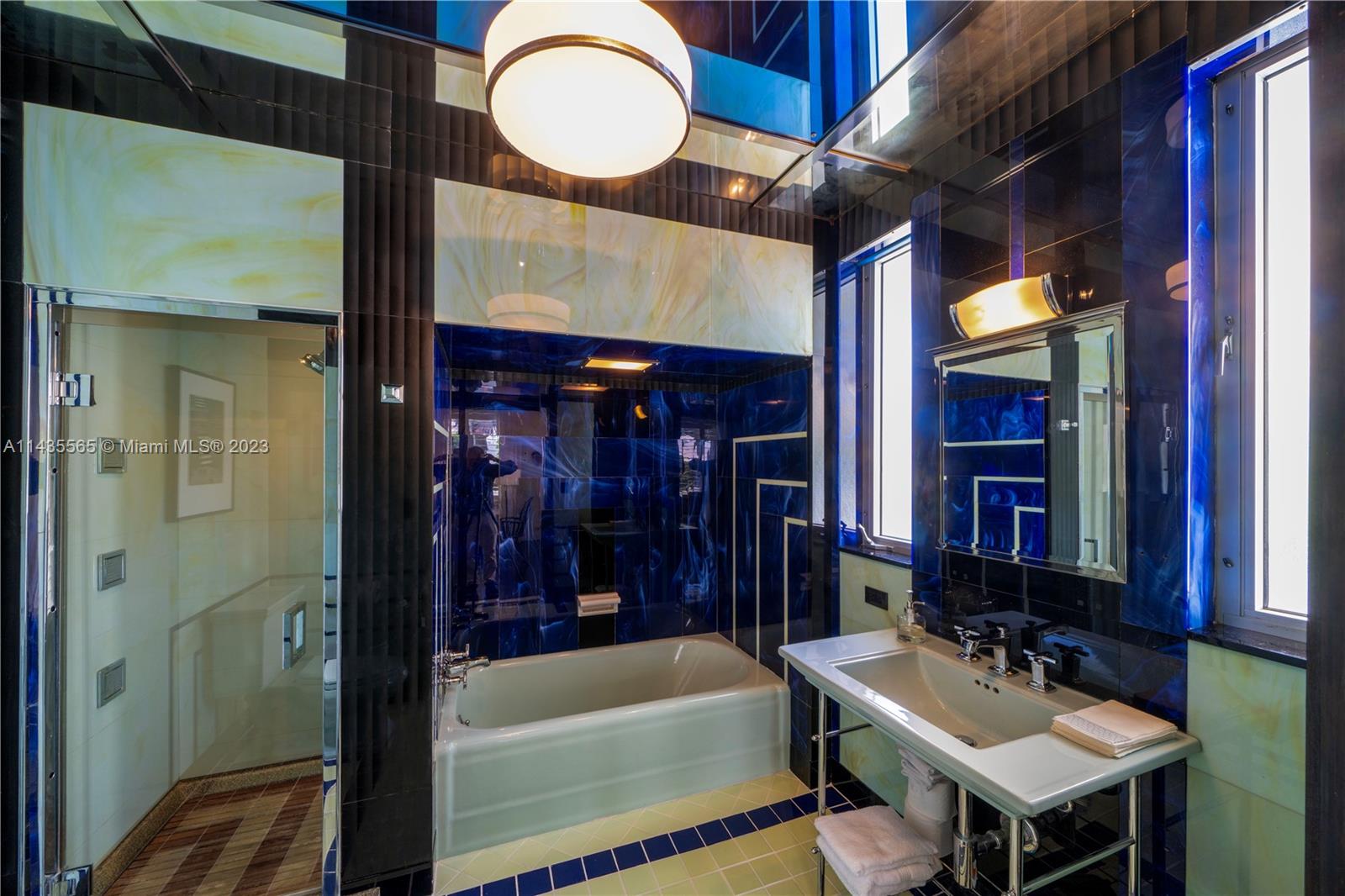 5959 La Gorce Drive Miami Beach, FL 33140 - Photo 38 of 60 a bathroom with a sink a toilet and shower