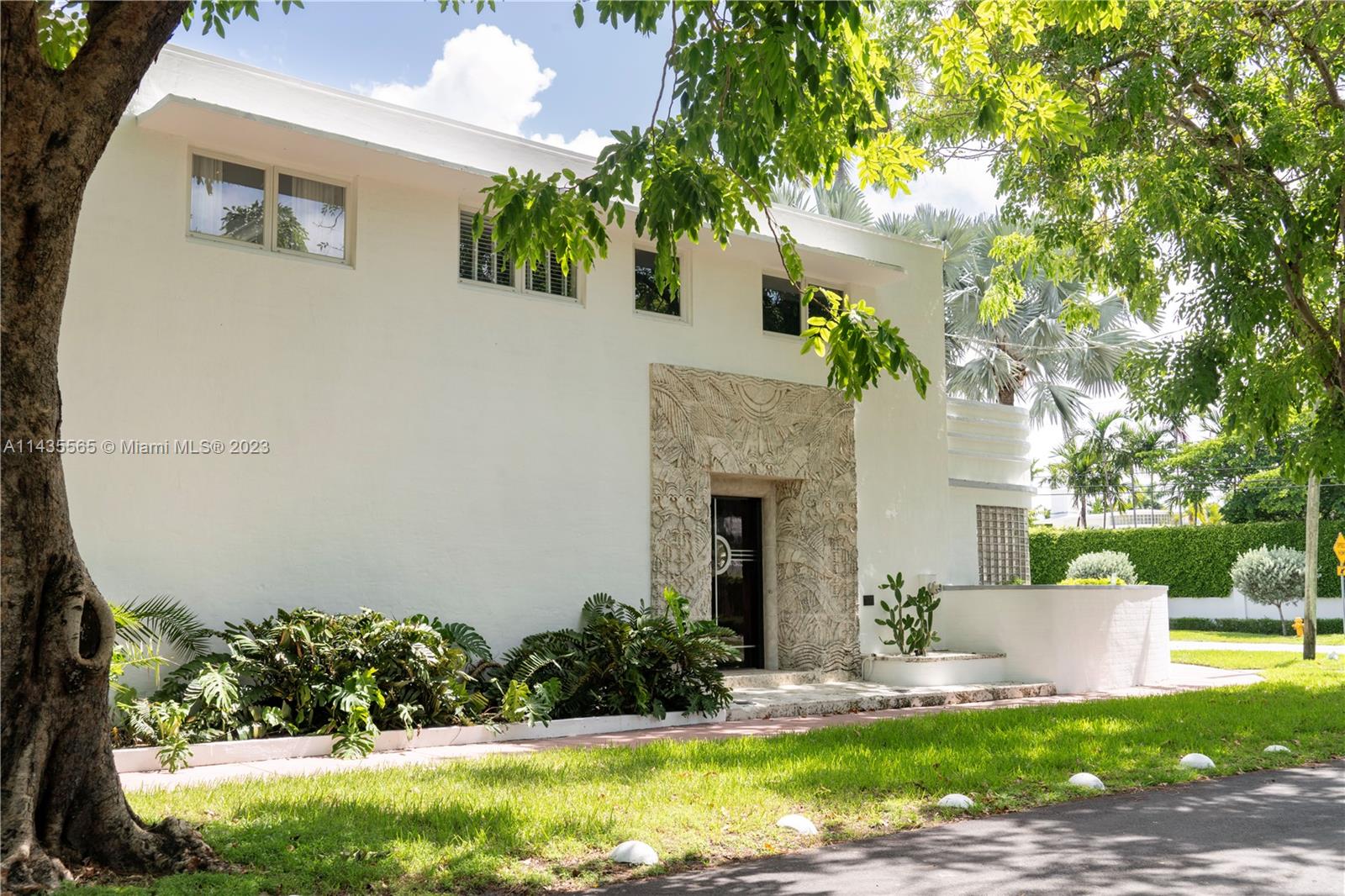 5959 La Gorce Drive Miami Beach, FL 33140 - Photo 47 of 60 a front view of a house with garden