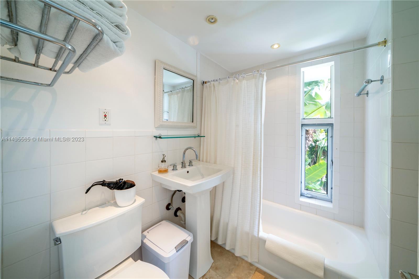 5959 La Gorce Drive Miami Beach, FL 33140 - Photo 52 of 60 a bathroom with a sink toilet and shower