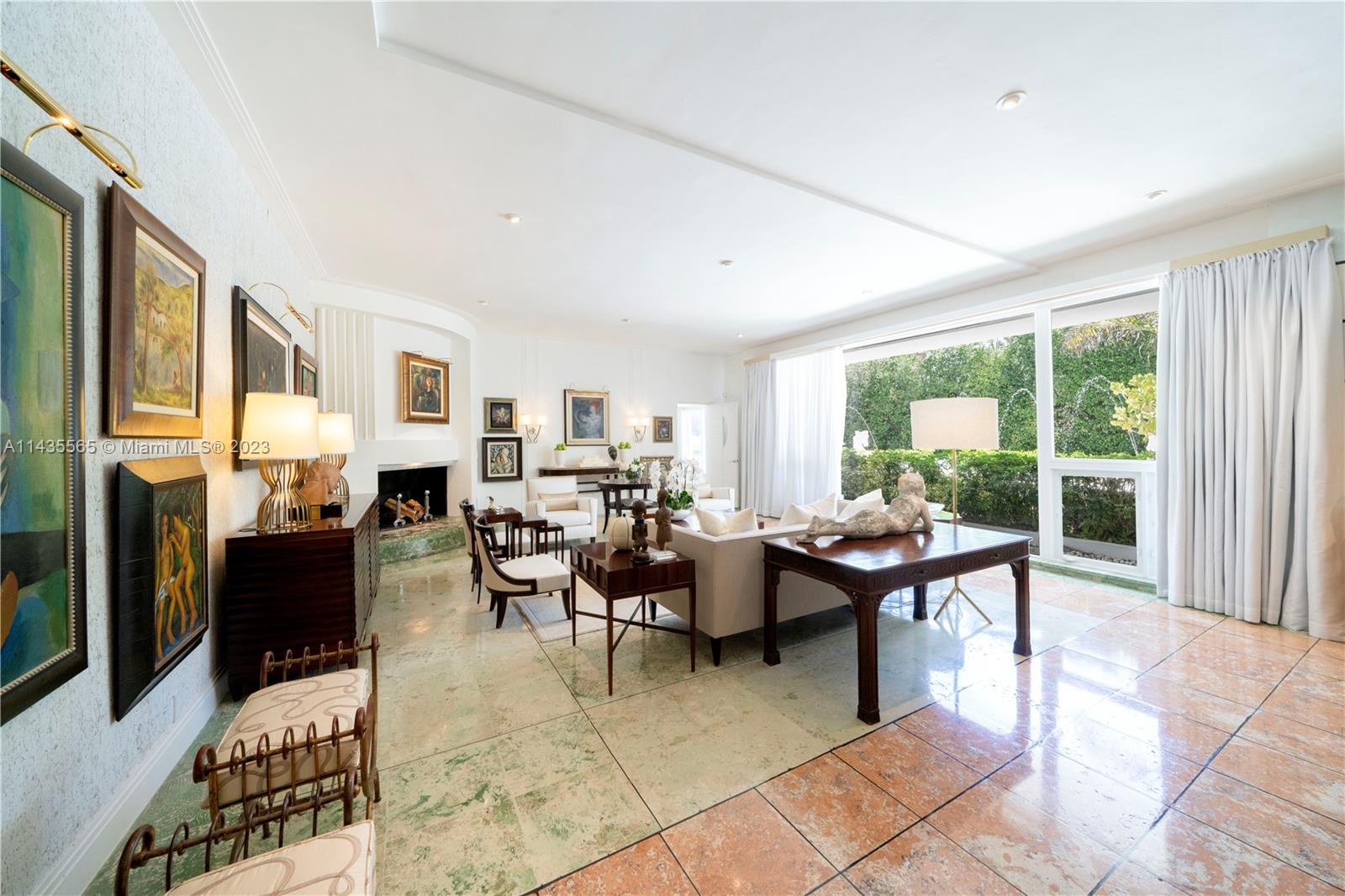 5959 La Gorce Drive Miami Beach, FL 33140 - Photo 7 of 60 a living room with fireplace furniture and a window