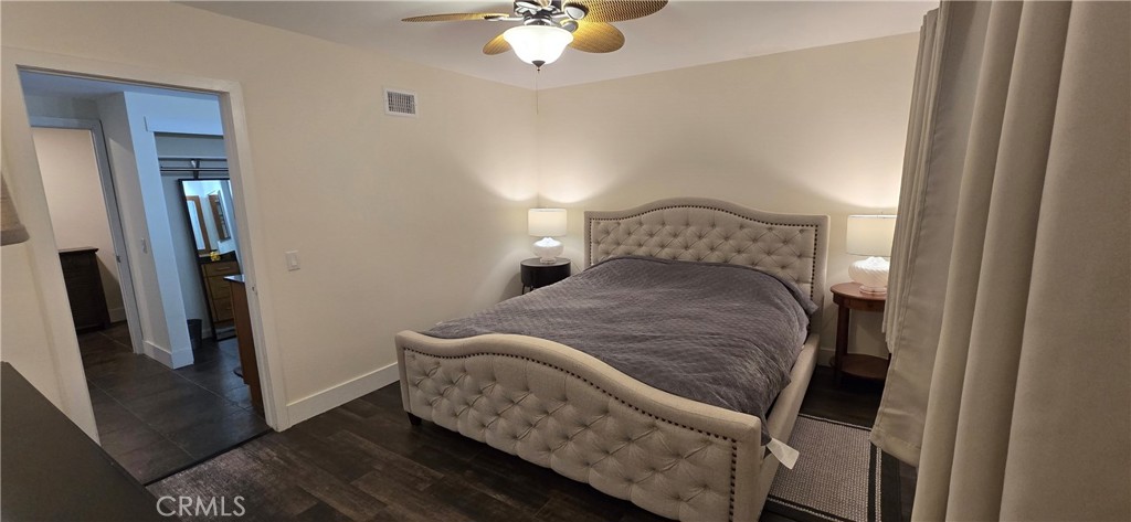 957 Magellan Street Costa Mesa, CA 92626 - Photo 16 of 24 a bedroom with a bed and a chandelier