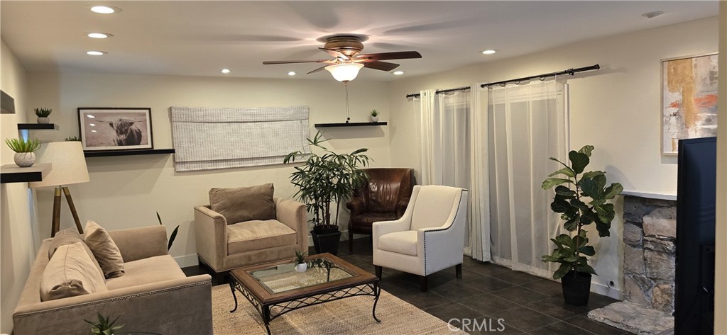 957 Magellan Street Costa Mesa, CA 92626 - Photo 3 of 24 a living room with furniture potted plant and a chandelier