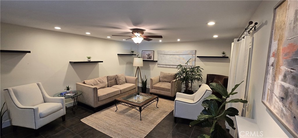 957 Magellan Street Costa Mesa, CA 92626 - Photo 5 of 24 a living room with furniture and a chandelier