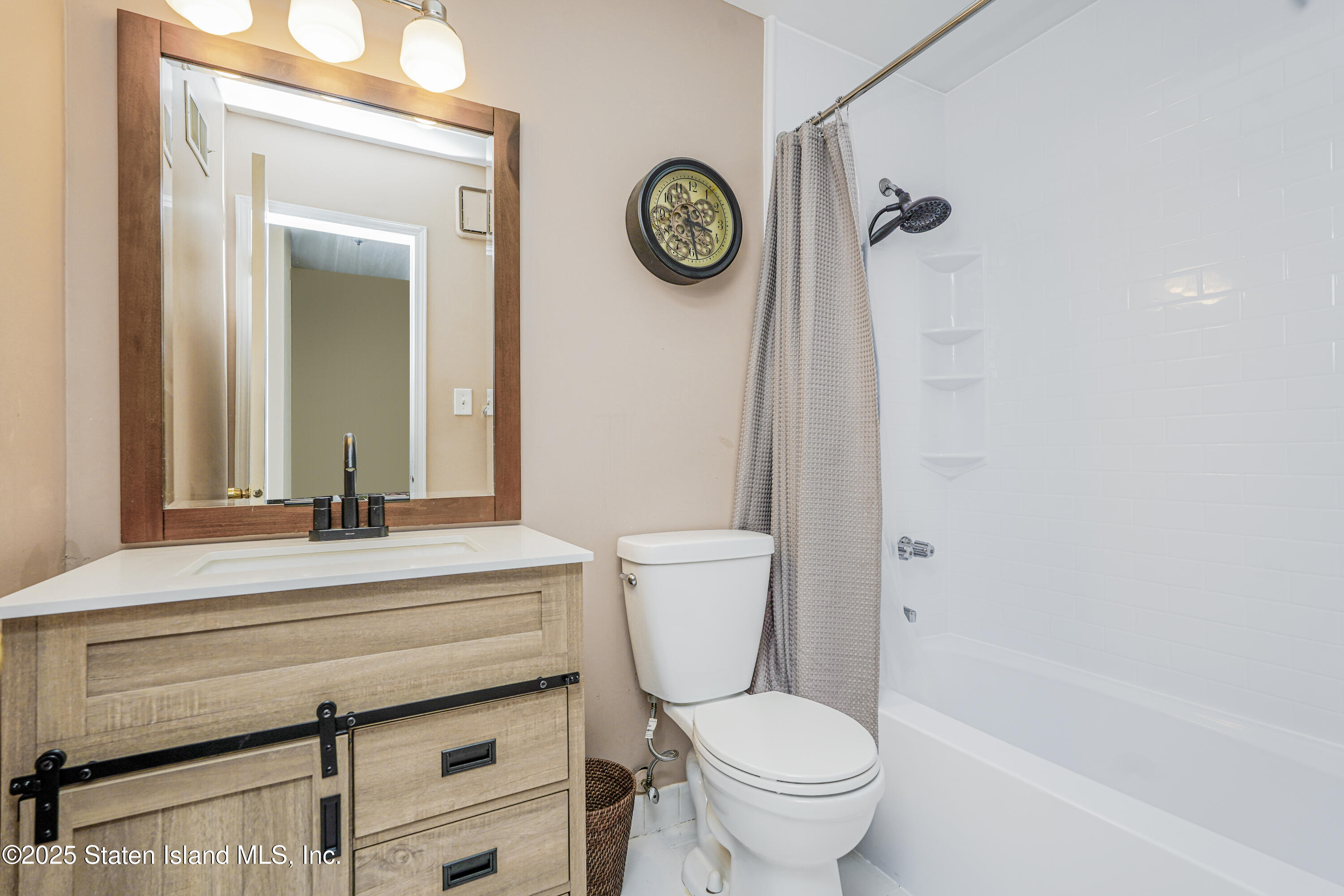 120 Pembrook Loop Staten Island, NY 10309 - Photo 12 of 24 a bathroom with a toilet a sink and a mirror