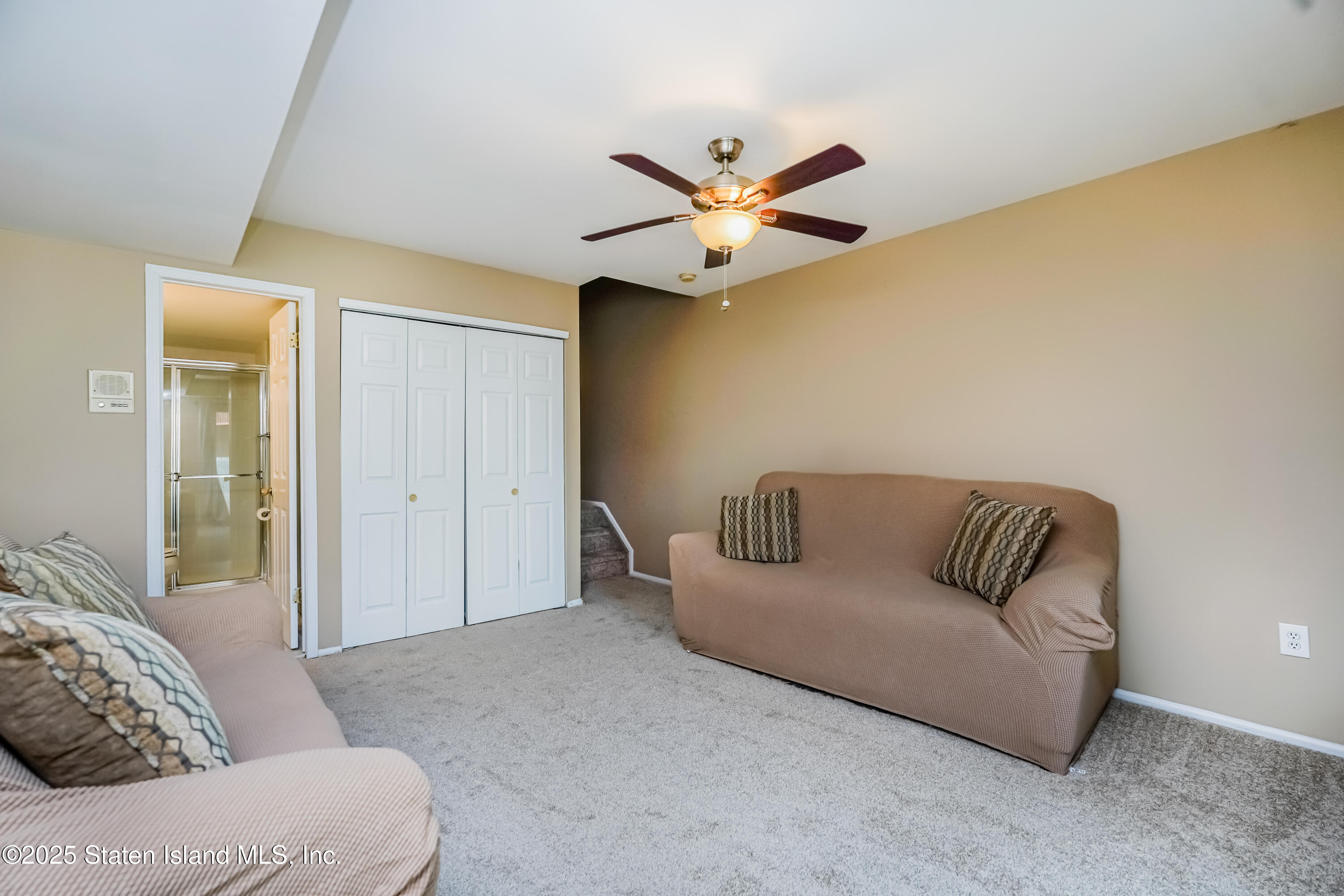 120 Pembrook Loop Staten Island, NY 10309 - Photo 16 of 24 a living room with furniture and a ceiling fan