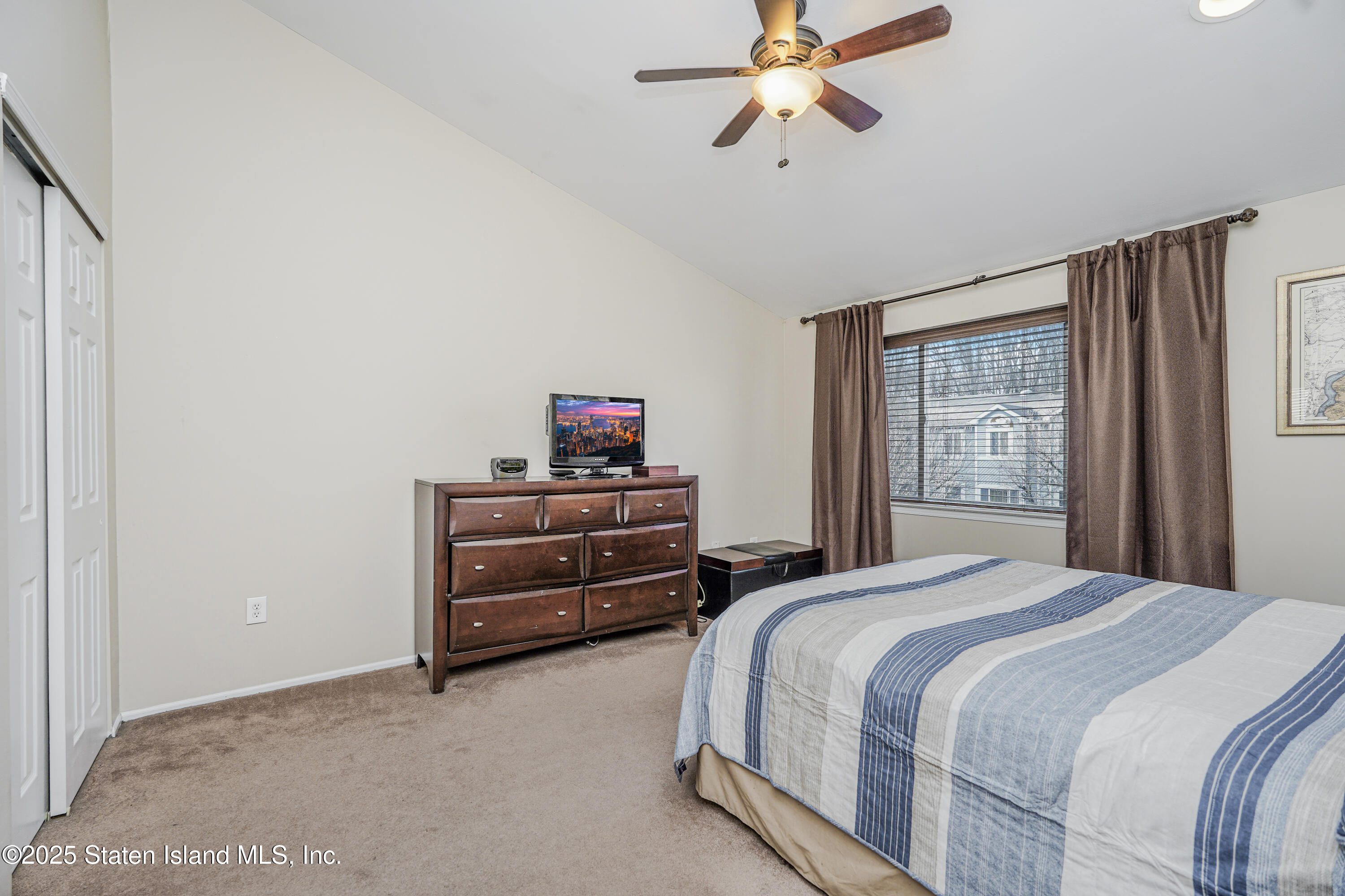 120 Pembrook Loop Staten Island, NY 10309 - Photo 21 of 24 a bedroom with a bed and a window