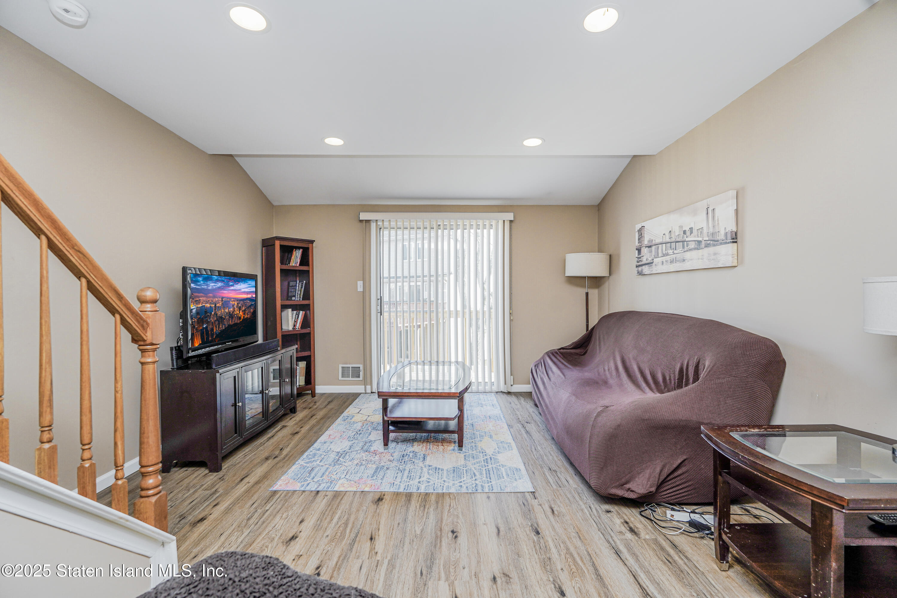 120 Pembrook Loop Staten Island, NY 10309 - Photo 5 of 24 a living room with furniture and a flat screen tv