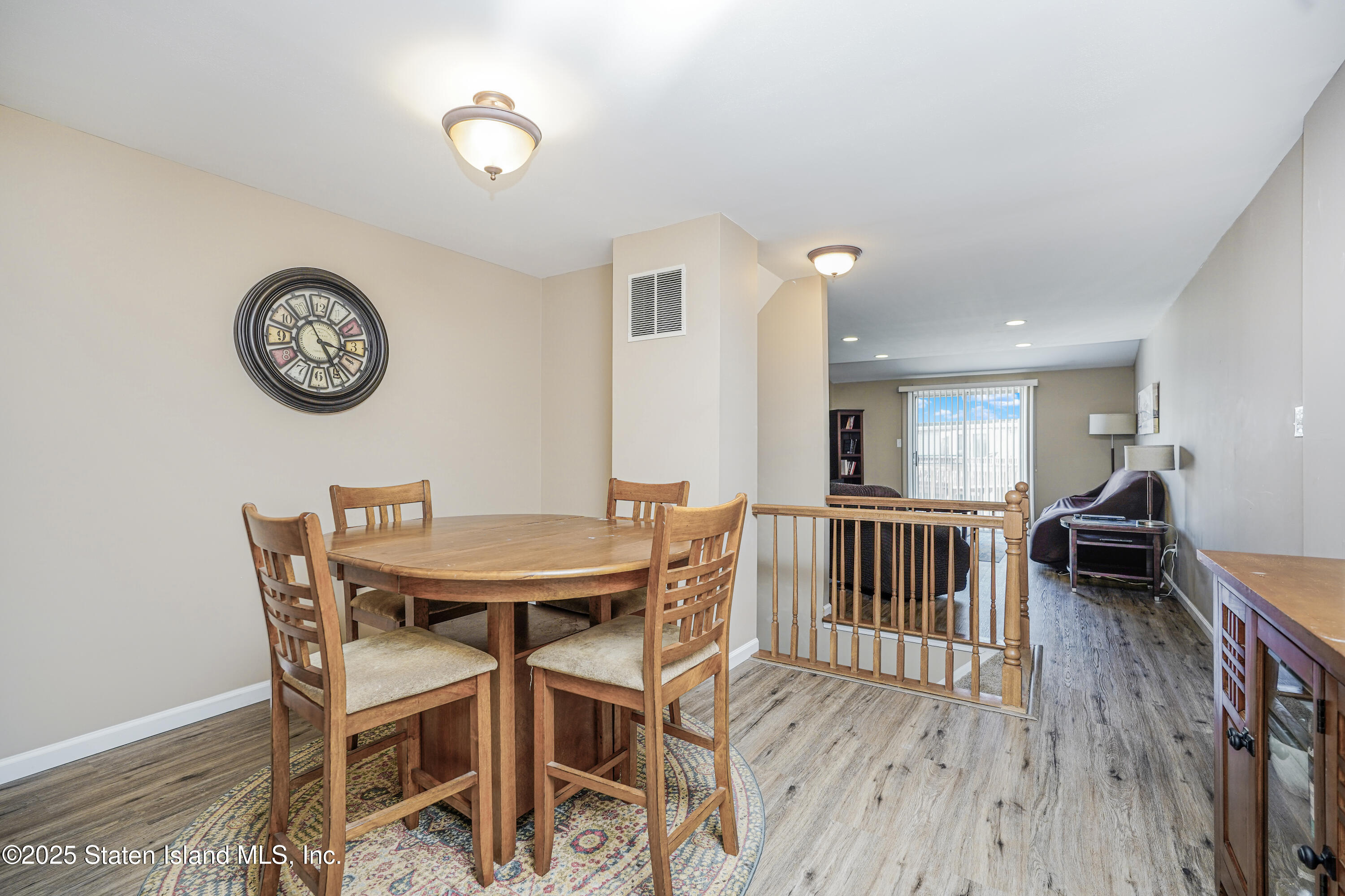 120 Pembrook Loop Staten Island, NY 10309 - Photo 6 of 24 a view of a dining room with furniture and a chandelier