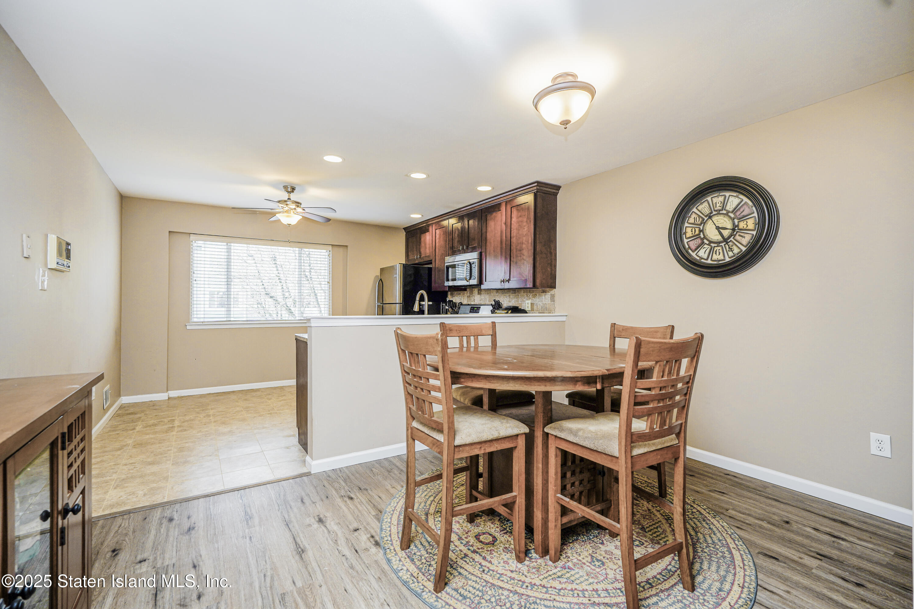 120 Pembrook Loop Staten Island, NY 10309 - Photo 7 of 24 a view of a dining room with furniture and a table
