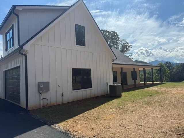 a view of a tree in a yard