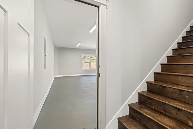 a picture of a bench in a white wall