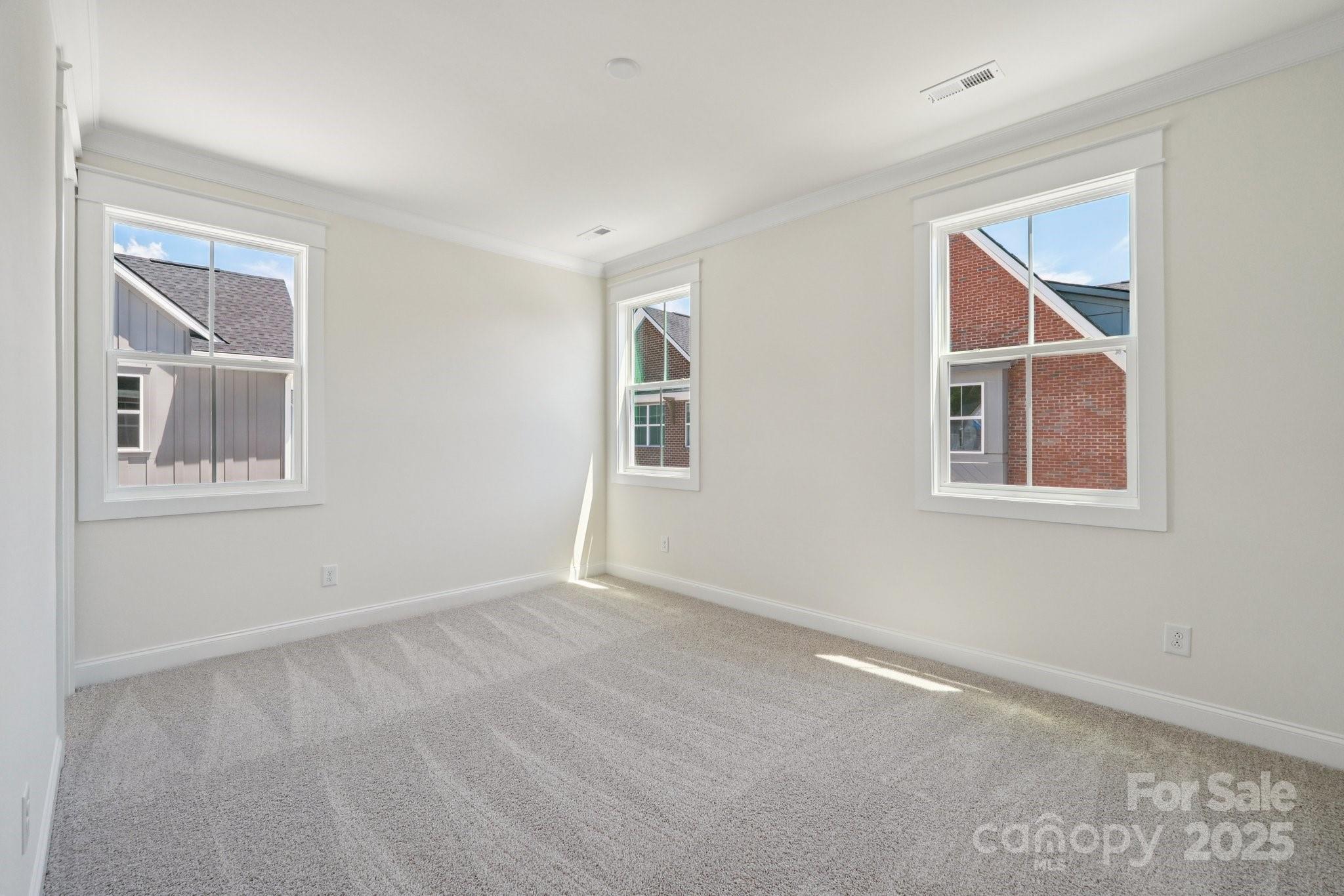 908 Coast Drive Tega Cay, SC 29708 - Photo 13 of 14 a view of an empty room with a window