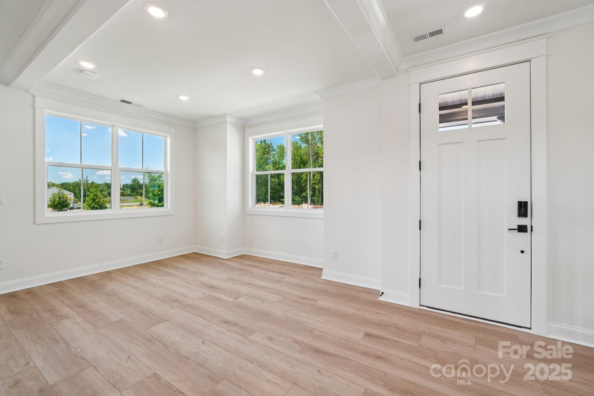 908 Coast Drive Tega Cay, SC 29708 - Photo 2 of 14 an empty room with windows and closet