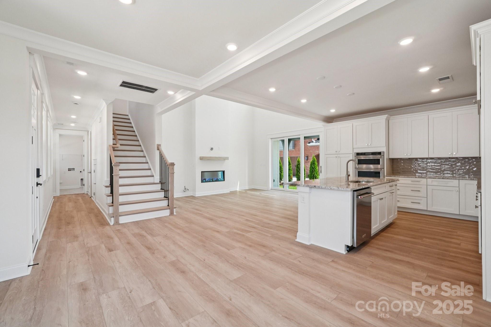 908 Coast Drive Tega Cay, SC 29708 - Photo 3 of 14 a view of kitchen with microwave and cabinets