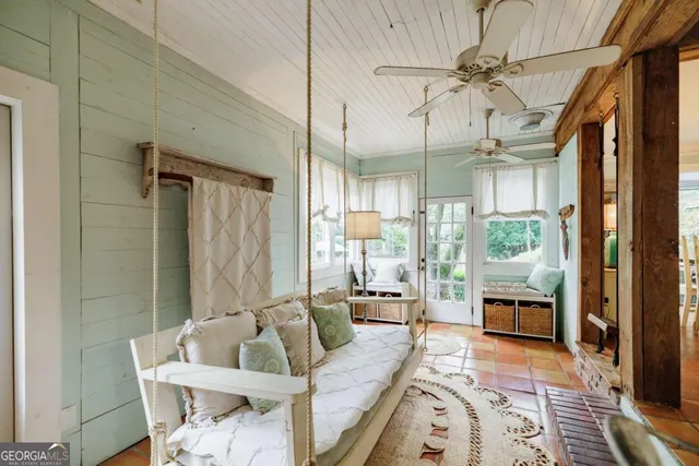 a backyard of a house with yard and outdoor seating