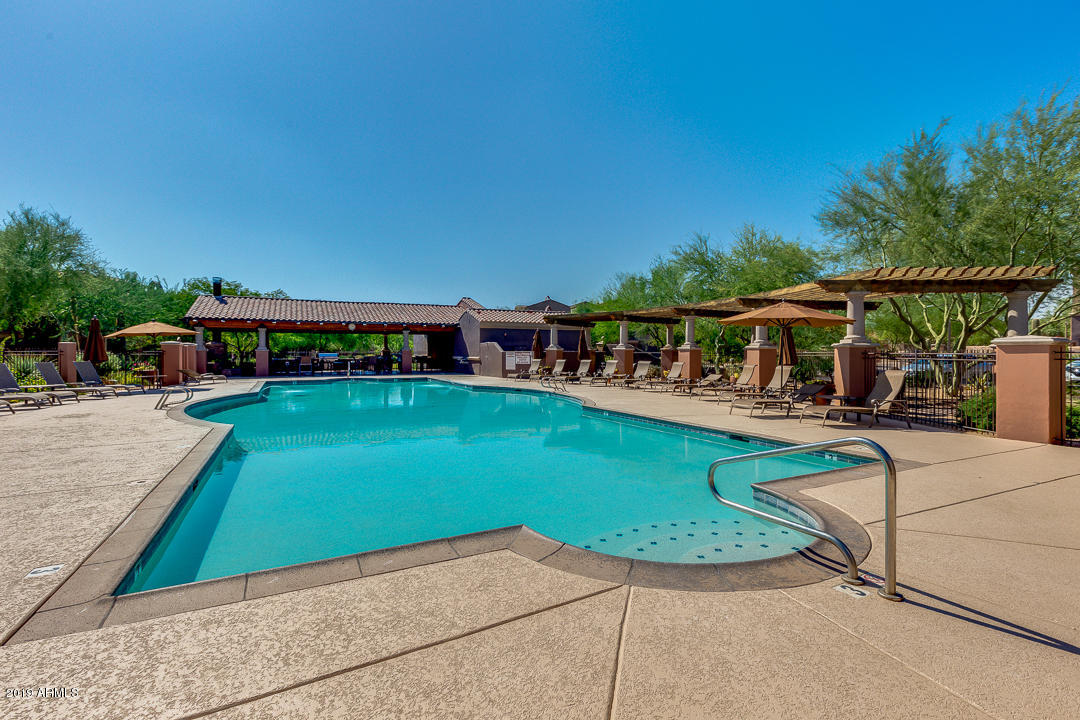 3935 East Rough Rider Road, Unit 1241 Phoenix, AZ 85050 - Photo 35 of 45 a view of a swimming pool with a patio