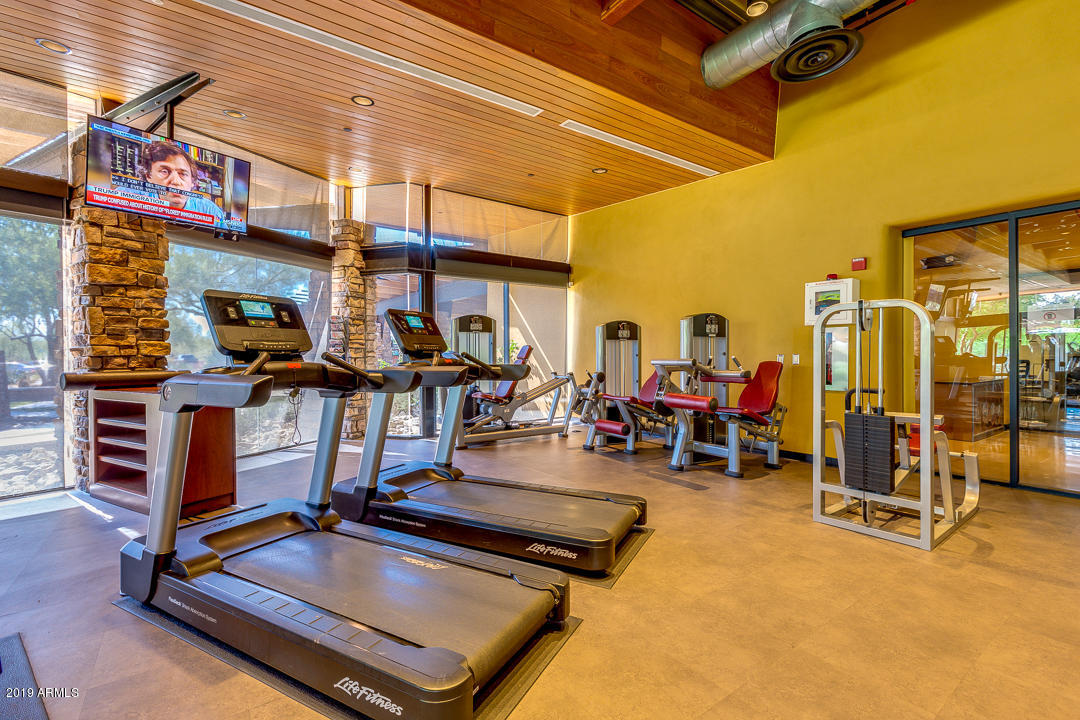 3935 East Rough Rider Road, Unit 1241 Phoenix, AZ 85050 - Photo 40 of 45 a view of a gym with a patio