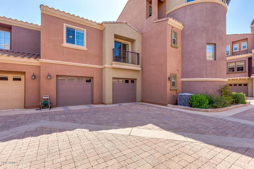 3935 East Rough Rider Road, Unit 1241 Phoenix, AZ 85050 - Photo 4 of 45 a view of backyard of a house