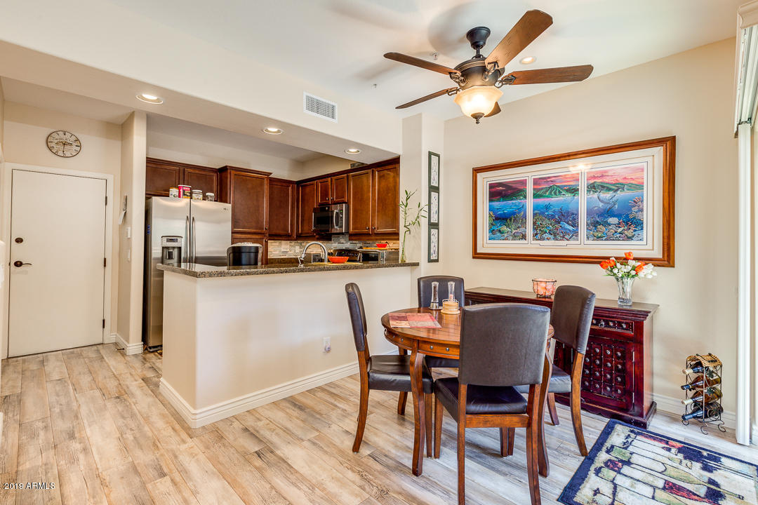 3935 East Rough Rider Road, Unit 1241 Phoenix, AZ 85050 - Photo 10 of 45 a view of kitchen with cabinets and wooden floor