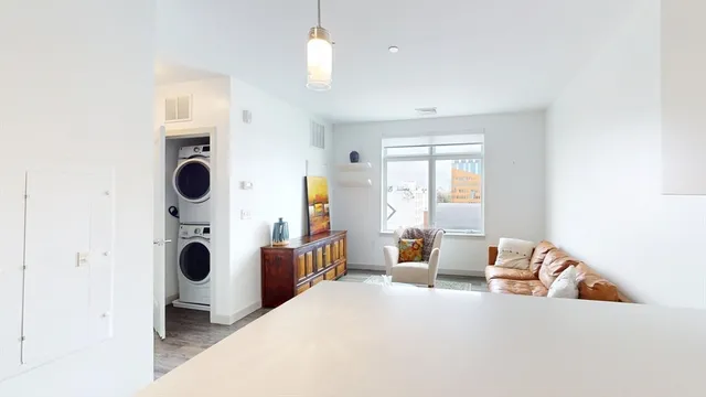 a bedroom with a bed and cabinets