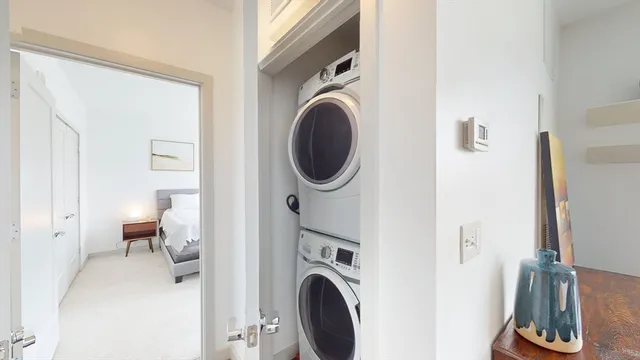 a view of a hallway with washer and dryer