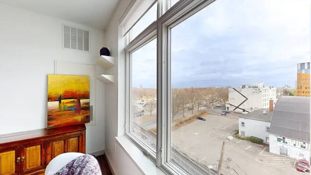 a view of a balcony with table and chairs