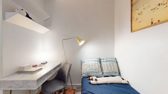 a view of a workspace with furniture and wooden floor