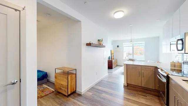 a kitchen with a refrigerator and a sink