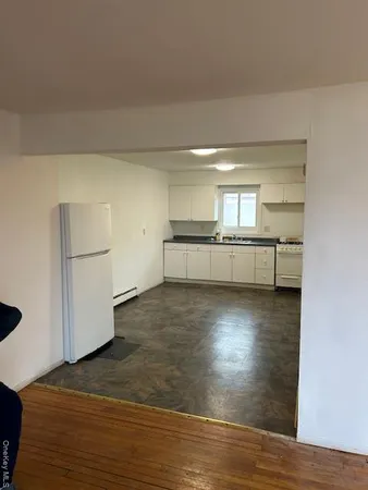 a kitchen with stainless steel appliances a refrigerator and a stove